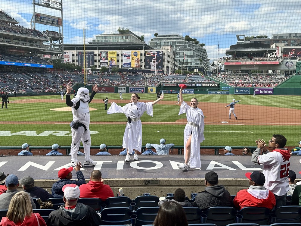 Ieva and teammates in Star Wars costumes on top of the dugout