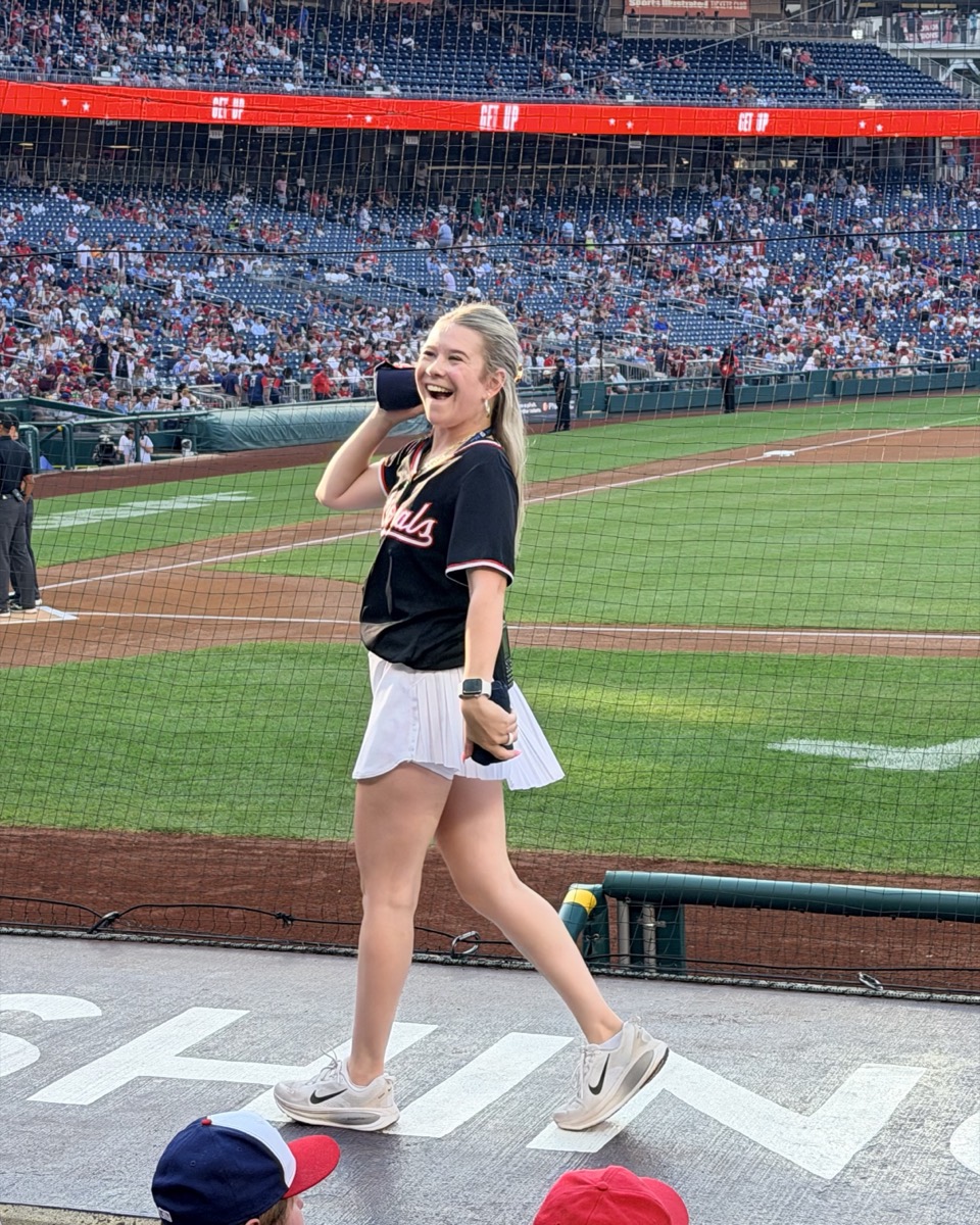 Ieva on top of the dugout at Nationals Park, working the crowd